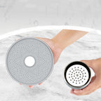 Shower head face beside an open cartridge housing